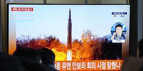 People watch a TV showing a file image of North Korea's missile launch during a news program at the Seoul Railway Station in Seoul, South Korea. (File Photo | AP)