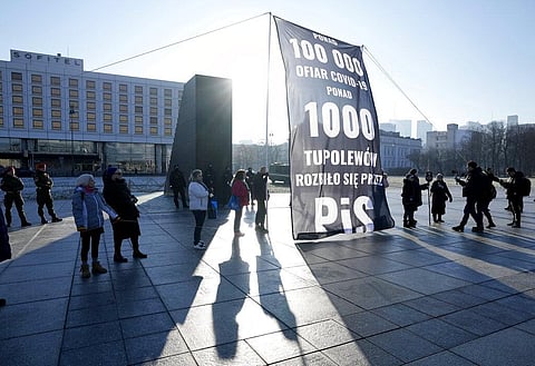 A group of critics protest against government policies on fighting COVID-19 in downtown Warsaw, Poland, on Sunday, Jan. 9, 2022. (Photo | AP)