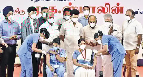 Chief Minister MK Stalin oversees healthcare workers administering booster dose to people in Chennai on Monday after launching the drive | P Jawahar