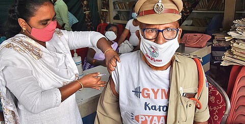 A policeman gets preacautionary vaccine dose in Viajayawada (Photo I EPS, P Ravindra Babu)