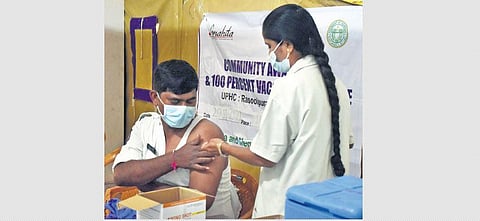 A health worker administers a booster dose to a police personnel at Begumpet in Hyderabad on Tuesday, Jan 11, 2022. (Photo | EPS, S Senbagapandiyan)