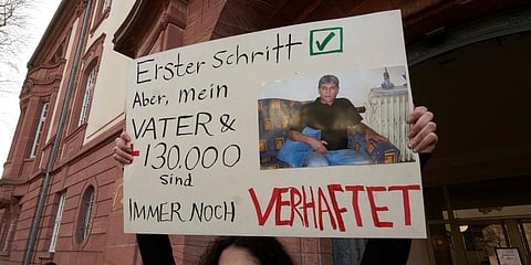 Serda Alshehabi comments on the verdict in front of the building of the Higher Regional Court in Koblenz. (Photo | AP)