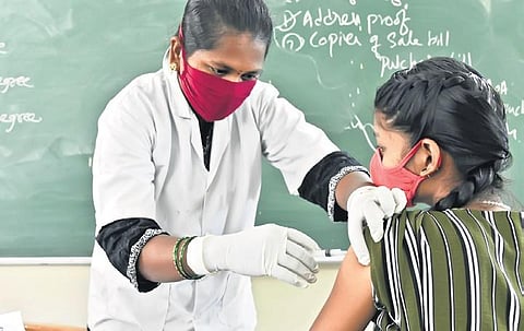 A health worker administers Covid vaccine to a girl on Friday, Jan 7, 2022. (Photo | EPS, Vinay Madapu)