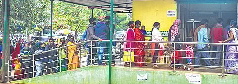 Despite Covid-19 surge, people line up outside an Aahar centre without maintaining safe distance in Bhubaneswar (Photo I Express)