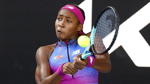 Coco Gauff of the U.S. plays a backhand return to Wang Qiang of China during their first round match at the Australian Open tennis championships in Melbourne. 