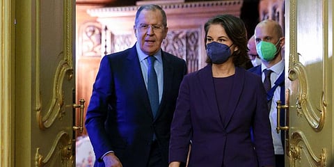 Russian Foreign Minister Sergey Lavrov and German Foreign Minister Annalena Baerbock arrive to attend a joint news conference following their talks in Moscow, Russia, Jan. 18, 2022. (Photo | AP)