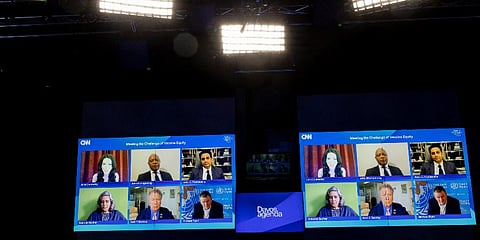 Panelists during the remotely held panel titled 'The Challenge of Vaccine Equity', at the Davos Agenda 2022, Jan. 18, 2022. Dr. Michael Ryan is on the bottom right on both screens. (Photo | AP)