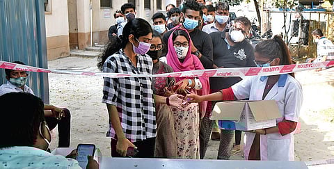 People line up to get tested for Covid at a primary health centre in Bengaluru. (Photo| Vonod Kumar T, EPS)