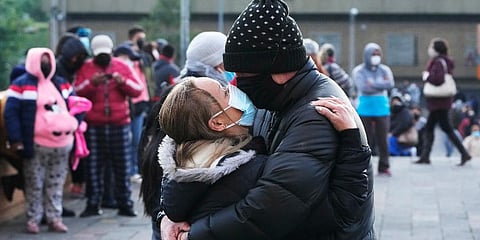 A couple embrace as they wait for a COVID-19 testing center to open, in Quito, Ecuador, Tuesday, Jan. 11, 2022. (Photo | AP)