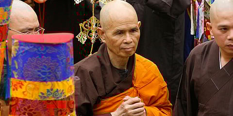 Vietnamese Zen master Thich Nhat Hanh (C) arrives for a great chanting ceremony at Vinh Nghiem Pagoda in Ho Chi Minh City. (File photo| AP)