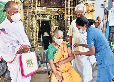 A woman gets a booster dose of Covid-19 vaccine in Chennai. (File photo| P Jawahar, EPS)