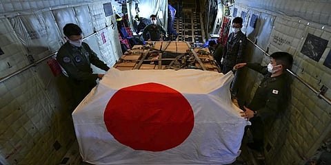 In this photo provided by Japan Joint Staff Office, members of Japan Air Self-Defense Force prepare to arrive at Tonga's Fua'amotu International Airport.(Photo | AP)