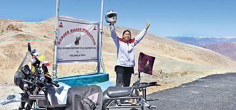Kanchan Ugursandi celebrating the completion of a month-long solo motorcycle expedition to Ladakh’s Umling La Pass, which is the world’s highest motorable road