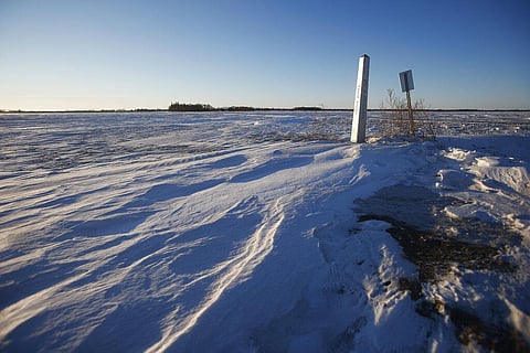 A border marker, between the United States and Canada, is shown just outside of Emerson, Manitoba, on Thursday, Jan. 20, 2022. (Photo | AP)