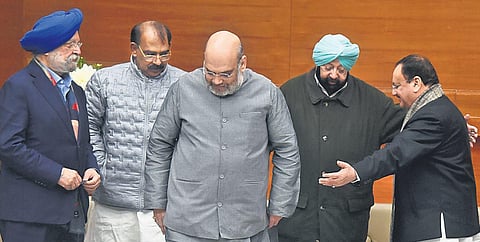 Senior BJP leaders Hardeep Singh Puri, Amit Shah and JP Nadda with former Punjab chief minister Amarinder Singh in New Delhi on Monday. (Photo | Parveen Negi/EPS)