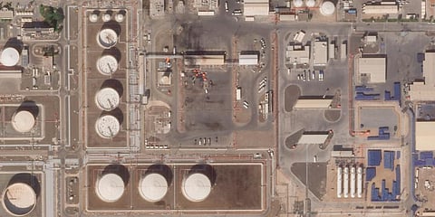 The aftermath of an attack claimed by Yemen's Houthi rebels on an Abu Dhabi National Oil Co. fuel depot in the Mussafah neighborhood of Abu Dhabi, United Arab Emirates. (Photo | AP)