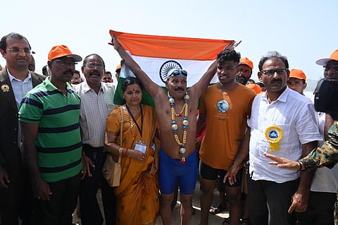 Gangadhar entered the sea in Padukare at 7.50 am and completed his feat at 1.25 pm. (Photo | Special Arrangement)