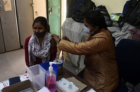 A healthworker administers a dose of Covid-19 vaccine to a beneficiary at a vaccination centre, in New Delhi on Thursday. (Photo | Parveen Negi/EPS)
