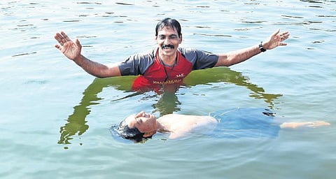 Mohammad Aasim P with his trainer Saji Valassery
