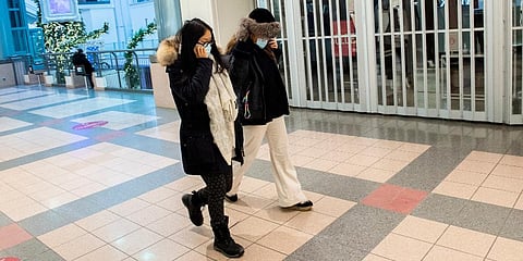 People walk by a closed store in a mall in Montreal, Sunday, Jan. 2, 2022, as the COVID-19 pandemic continues in Canada. (Photo | AP)