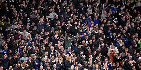 Chelsea supporters in the standing area of the ground celebrate during the English Premier League soccer match between Chelsea and Liverpool at Stamford Bridge in London. (Photo | EPS)