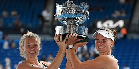 Barbora Krejcikova, right, and Katerina Siniakova of the Czech Republic hold their trophy after winning the Australian open women's doubles final, Jan 30, 2022. (Photo | AP)
