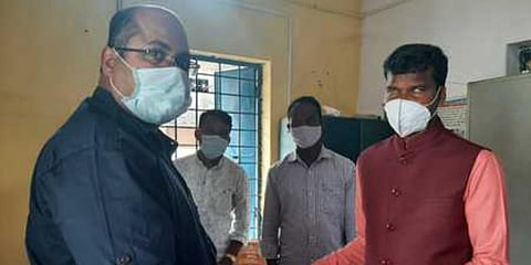 Shantilal Sabar (R) files his nomination papers. (Photo| EPS)