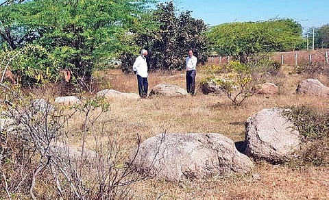 Archaeologists at the Iron Age burial site with Neolithic grooves that was found in a neglected condition in Yadadri-Bhuvanagiri district