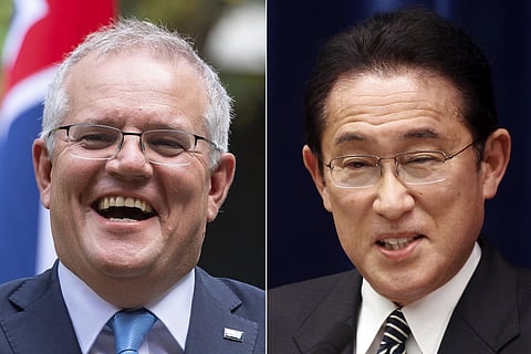 FILE - This combination of photos shows Australian Prime Minister Scott Morrison in London on June 15, 2021 and Japanese Prime Minister Fumio Kishida in Tokyo on Dec. 21, 2021. (AP)