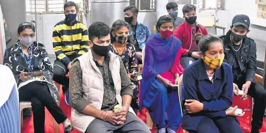 Teens sit in an observation room after receiving the vaccine. (Photo | Parveen Negi, EPS)