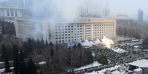 Smoke rises from the city hall building during a protest in Almaty, Kazakhstan, Wednesday, Jan. 5, 2022. (Photo | AP)
