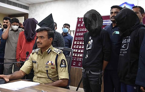 Hyderabad Commissioner of Police CV Anand addresses the media, on Thursday. The arrested peddlers are also seen | RVK Rao