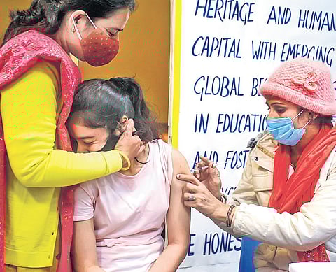 A health worker administers Covid-19 jab to a teenager at a Gurugram School | PTI