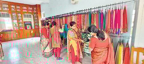 The sari bank in Gujarat's Anand district and women who borrow those for special occasions. (Photo| EPS)