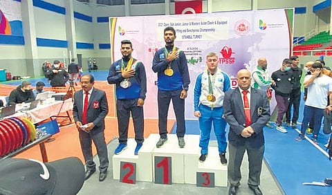 Prabhu on the podium after winning gold in Asian Powerlifting Championship in Turkey | Express