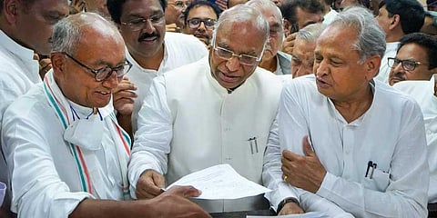 Congress leader Mallikarjun Kharge files his nomination papers for the post of party President, at AICC headquarters in New Delhi, Sept. 30, 2022. Digvijaya Singh, Ashok Gehlot are also seen. (PTI)
