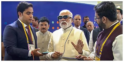 Prime Minister Narendra Modi with Akash Ambani, son of businessman Mukesh Ambani, during the inauguration of the 6th India Mobile Congress at Pragati Maidan in New Delhi. (Photo | PTI)