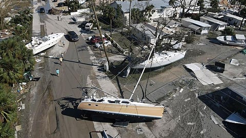 Boats lie scattered amid mobile homes after Hurricane Ian hit Florida's San Carlos Island. (Photo | AP)