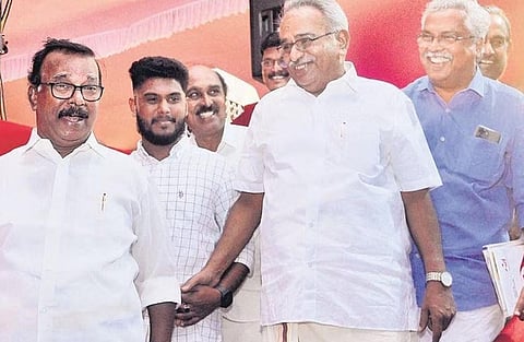 Kanam Rajendran cracks a joke with C Divakaran after the public meet at Putharikandam ground on Friday. Senior leaders Binoy Viswam, E Chandrasekharan and Sathyan Mokeri are also seen | B P Deepu
