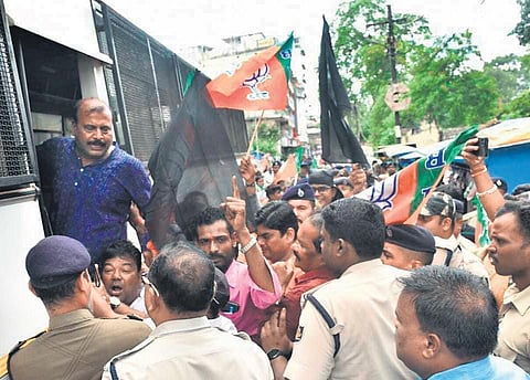 BJP workers waving black flags being taken into police custody at Rourkela | Express