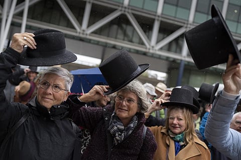 Campaigners take their hat off in a show of respect for people who took their own lives in The Hague, Netherlands, Monday, Oct. 10, 2022. (Photo | AP)