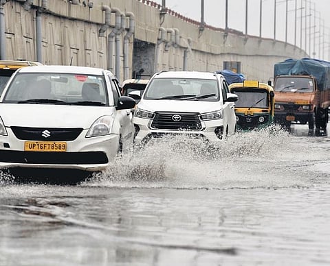 Vehicles ply on a waterlogged road during rains in the city on Monday | Parveen Negi