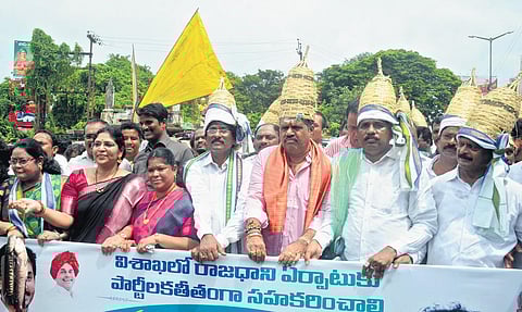 Wearing fisherman’s headgear, YSRC leaders take part in a rally in Vizag on Tuesday to mobilise people’s support for Visakha Garjana | G Satyanarayana