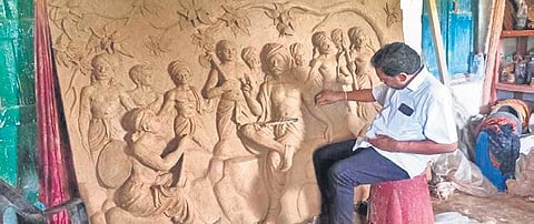 A local artist working on sculptures at the memorial | Express