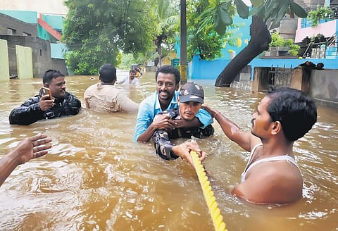 As floodwater entered colonies, rescue personnel shift people to relief centres in Anantapur on Wednesday. Water level hovered at 6-7 ft in some areas | Express