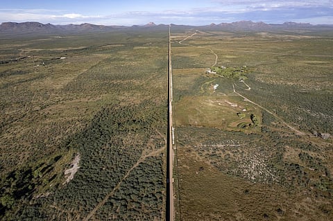 Aerial view of a section of the US (R) - Mexico (L) border wall crossing San Bernardino east Agua Prieta, Sonora state, Mexico. (Photo | AFP)