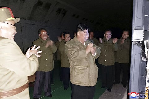 In this photo provided by the North Korean government, North Korean leader Kim Jong Un, center, supervises tests of long-range cruise missiles at an undisclosed location in North Korea. (Photo | AP)
