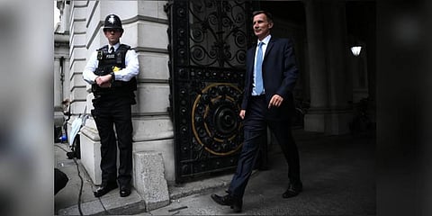 Britain's new Chancellor of the Exchequer Jeremy Hunt arrives in Downing Street in central London. (Photo | AFP)
