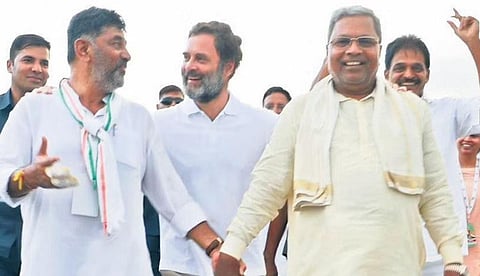 DK Shivakumar, Siddaramaiah and Rahul Gandhi share a light moment during the yatra