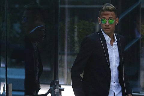 FC Barcelona's Neymar leaves the national court after testifying in an investigation into alleged irregularities regarding his transfer to Barcelona, in Madrid. (Photo | AP)